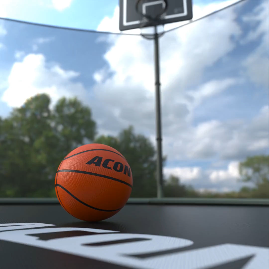 Basketbollsringens boll på trampolinmattan